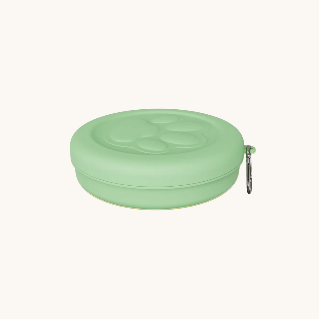 Green portable pet bowl clipped onto design suitable for hiking and camping