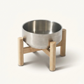 Stainless steel bowl on a wooden stand 