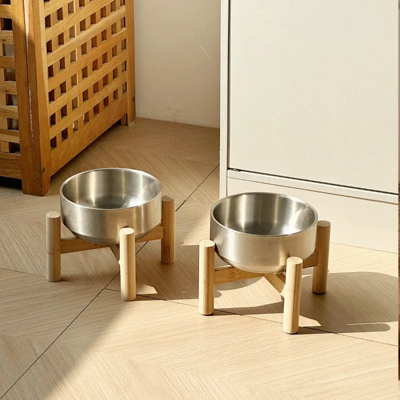 Two raised stainless steel pet bowls for water and food